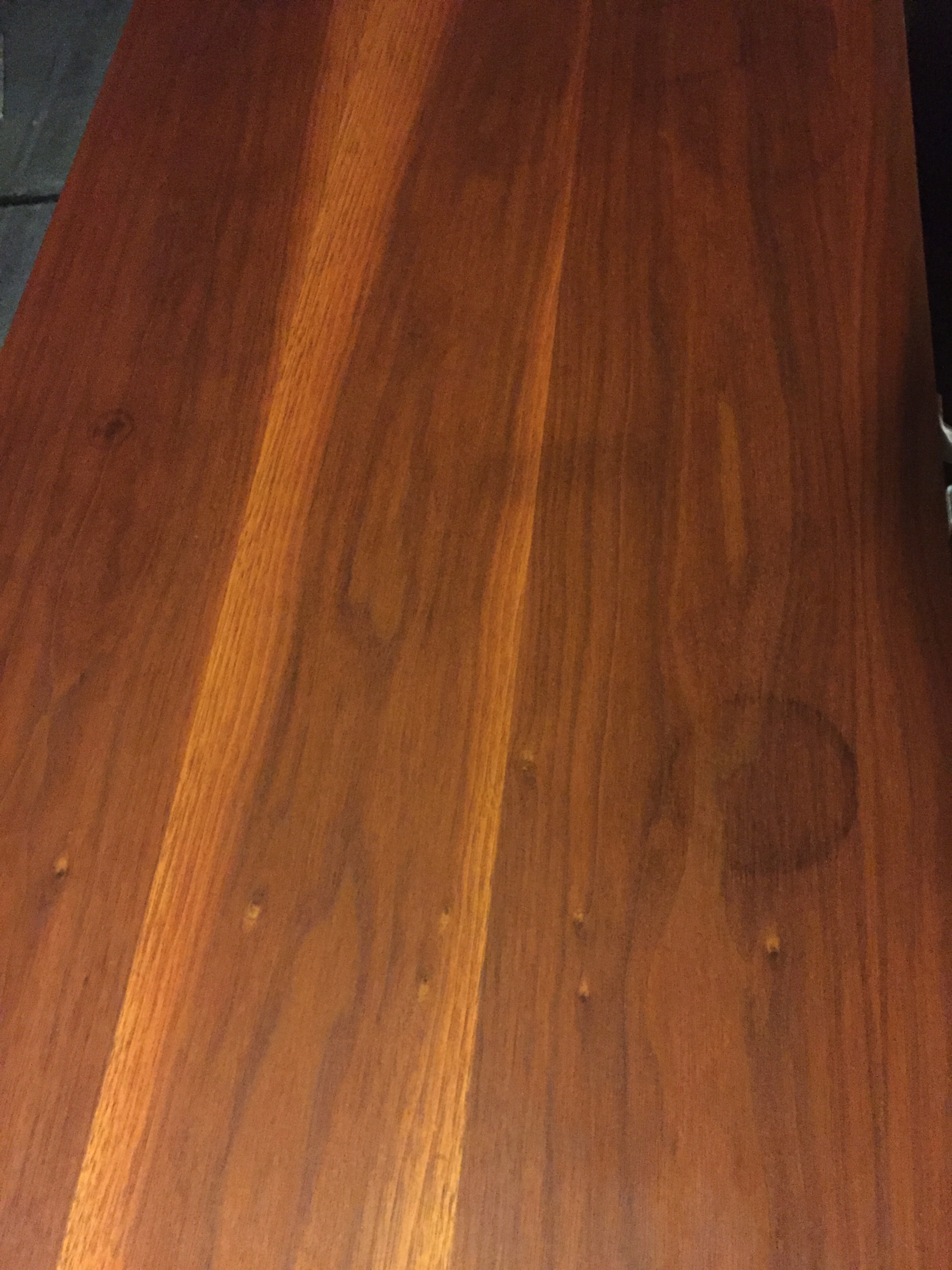 After lots of sanding and staining during the day (you can probably tell it is nighttime at this point from the pictures), this is the top of the long dresser and what's left of those previously hideous stains and marks. I couldn't get them out completely, but I'd say it looks pretty good!
