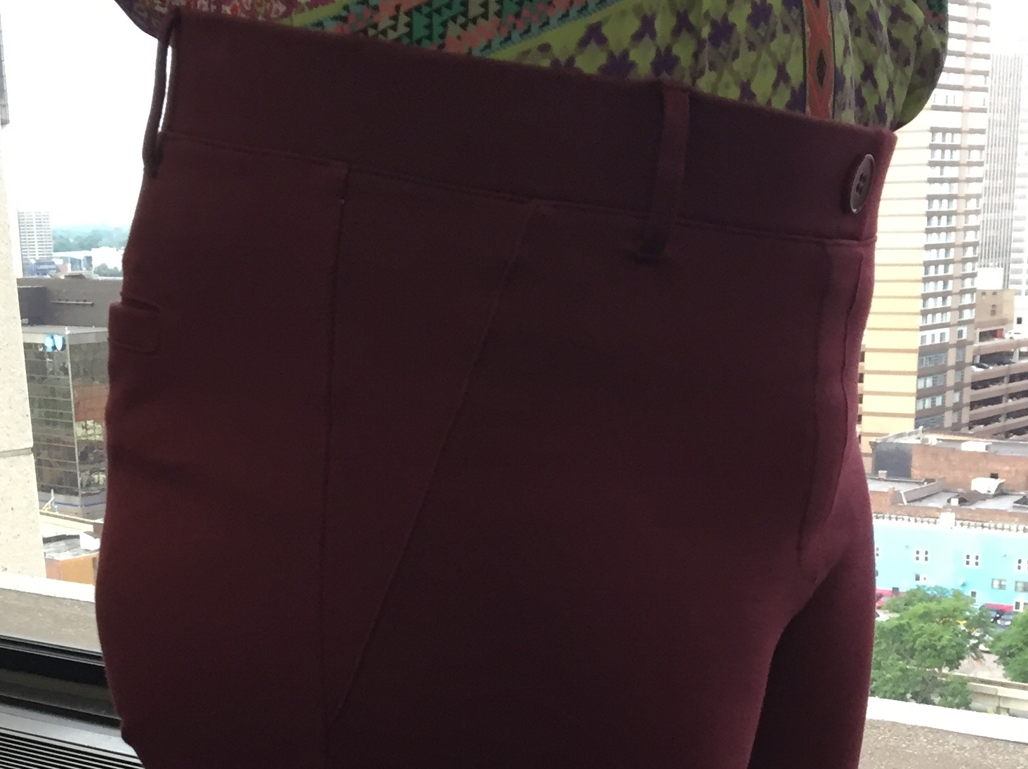 fake pockets (front and back), fake button (okay, real button, but not really closing anything), belt loops - sneaky!