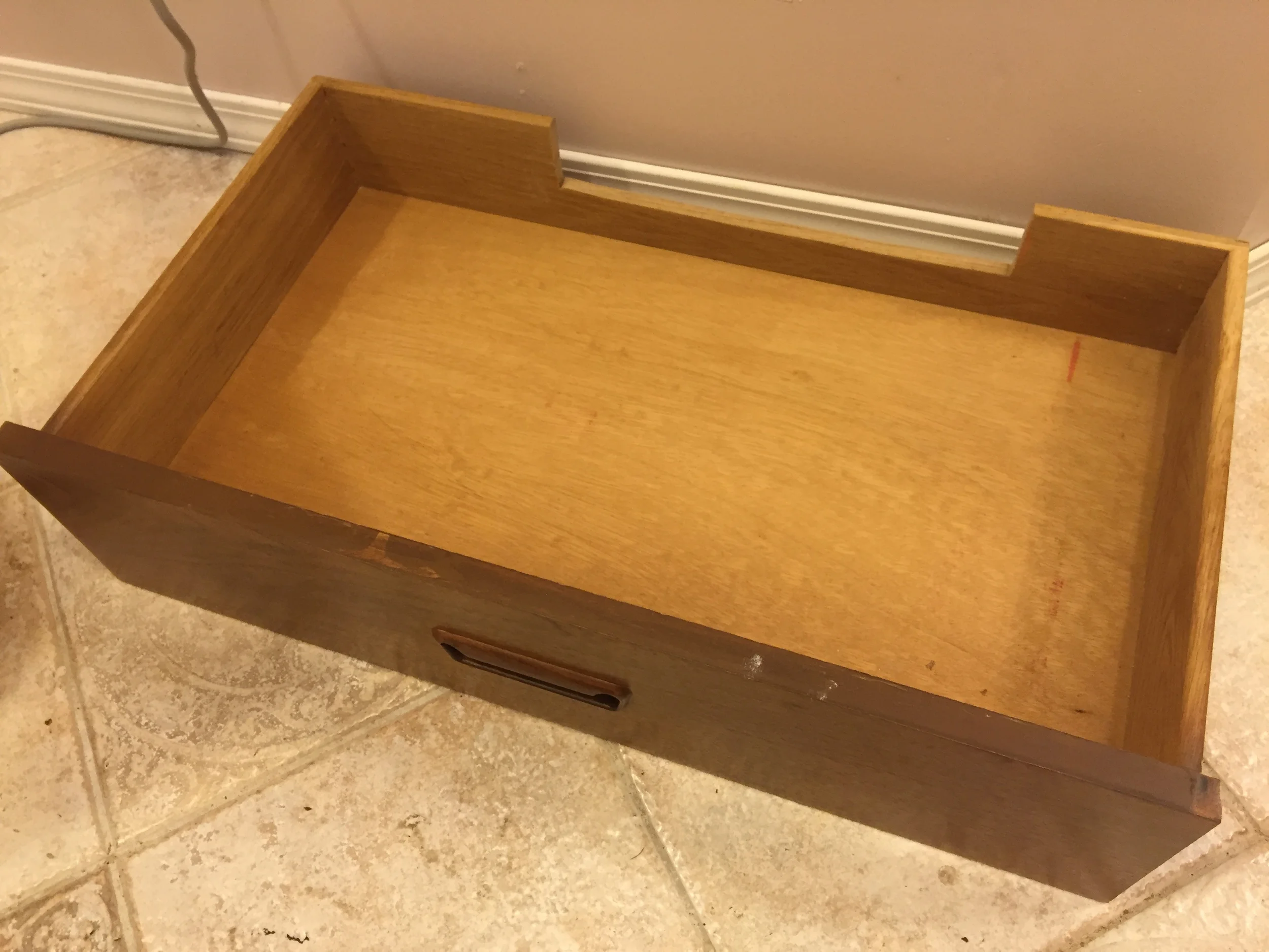 We had to cut a notch into the back of the bottom drawer to make room for the shut off valves.