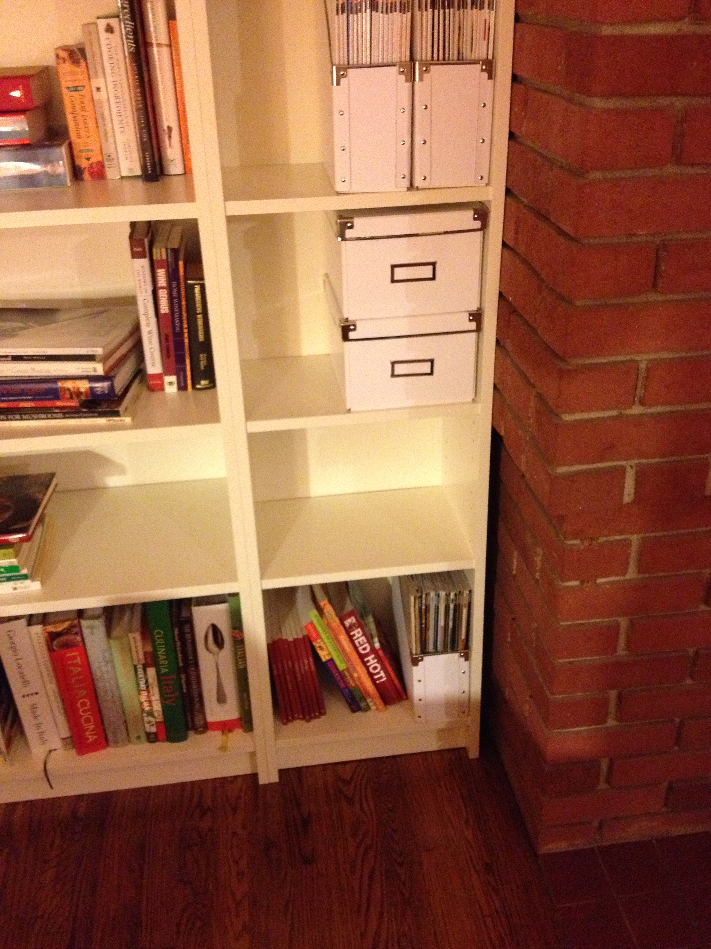 This is where the bookshelves meet the fireplace (picture taken pre-trimming the shelves out). Remember how the fireplace goes in a few inches on the lower half? That's why there's that gap there between the lower half of the fireplace and the bookshelves.
