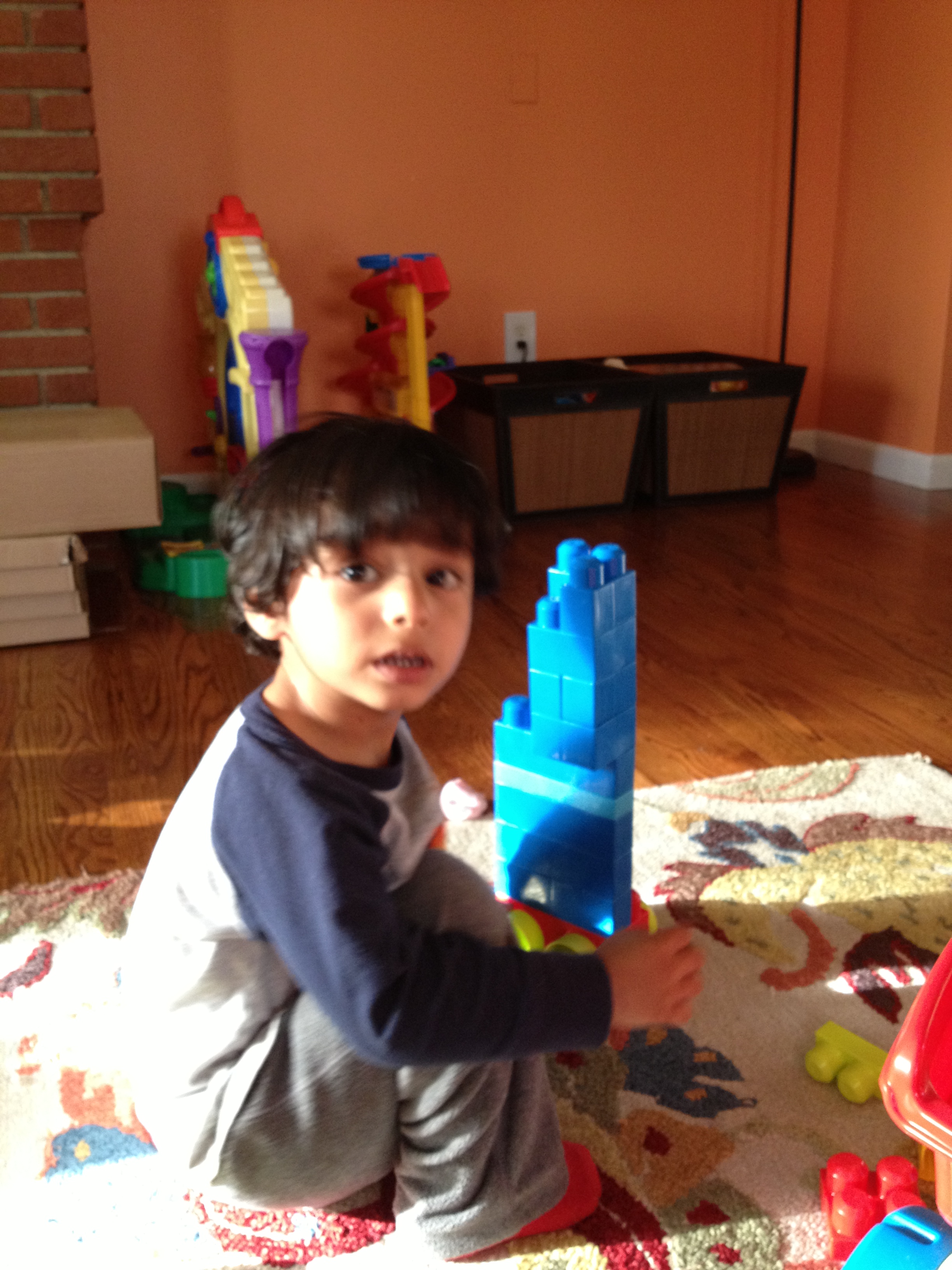 Now, after you're done looking at how cute my kid was, look at the side of the fireplace. See how that fireplace doesn't go straight down? It kind of goes in a few inches all the way around it. You'll see this again in a minute.