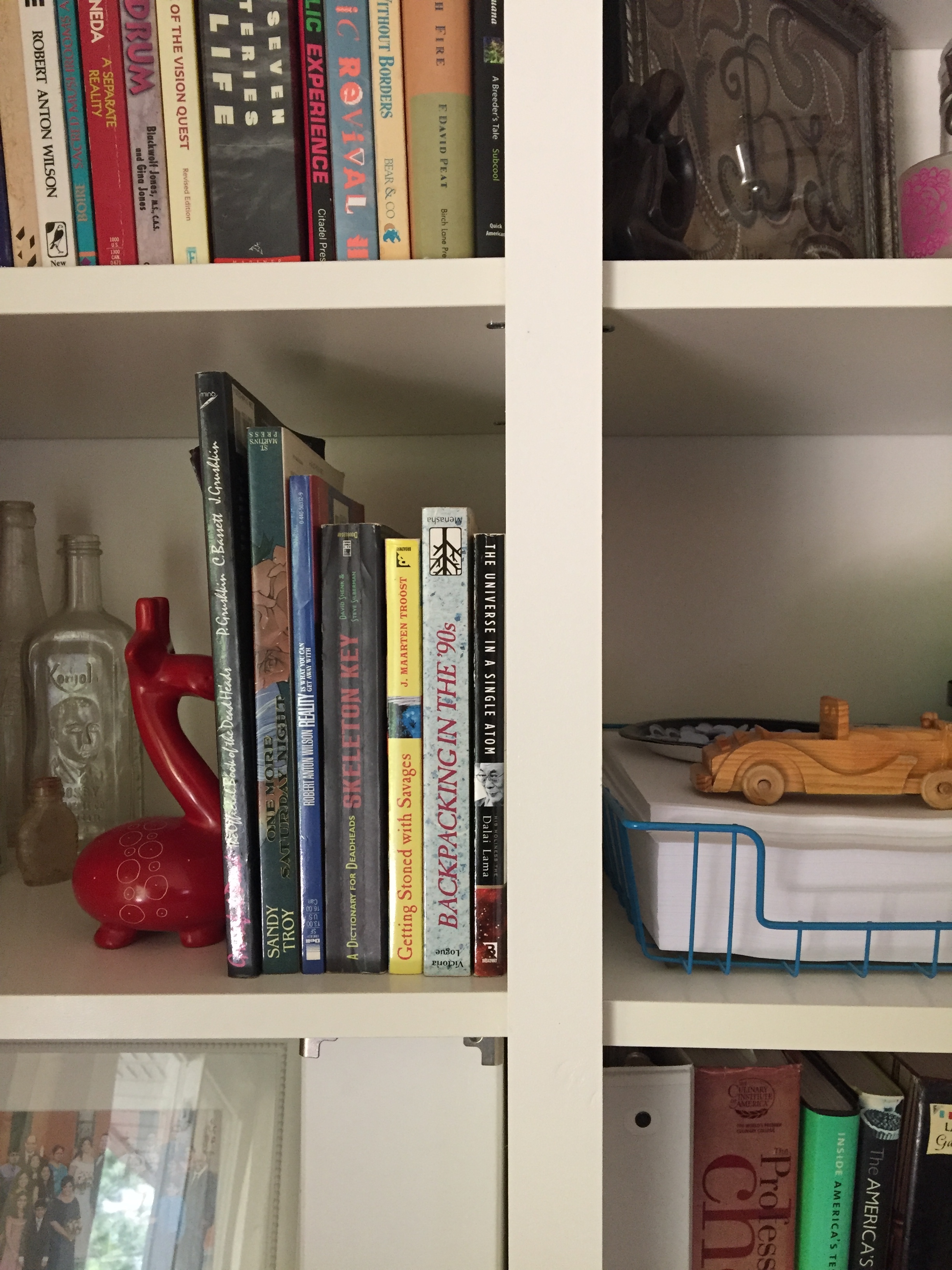 The trim that went over the sides of the shelves that met each other......