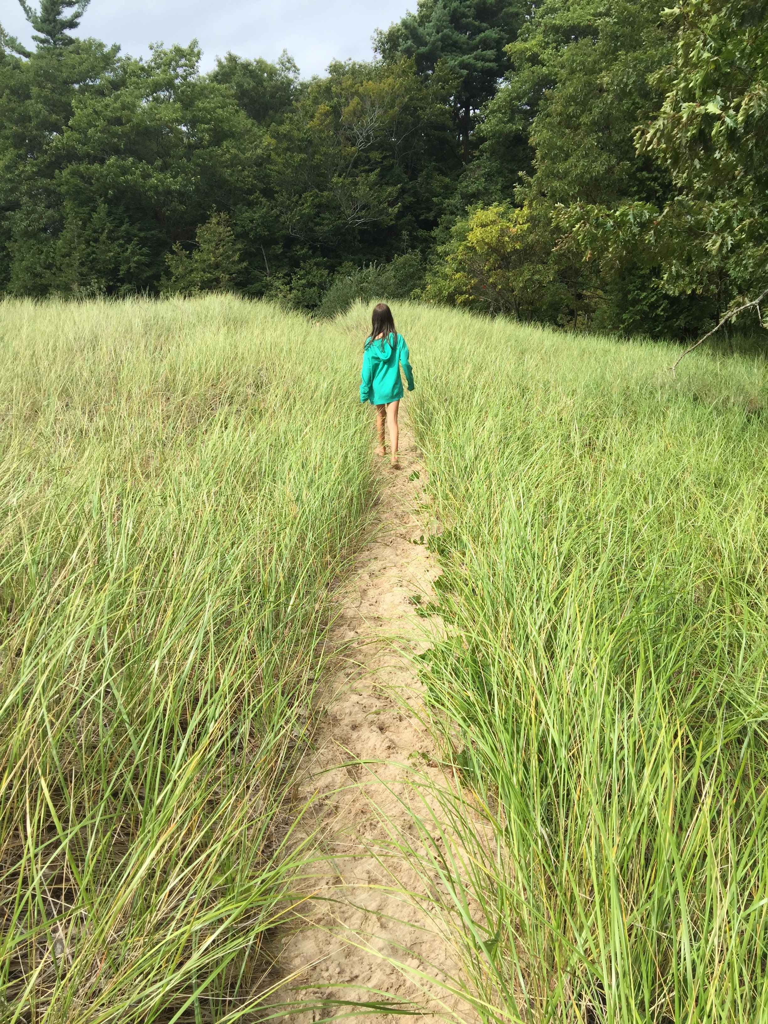 And this is Ava, Brooke's younger daughter, leading us out of the dunes. The perfect end to our beach trip. I said to Brooke, "Where can I hose all the sand off the kids?" She said it didn't matter, she was used to having sand from the beach all over her house. Now THAT is why I love Brooke. 