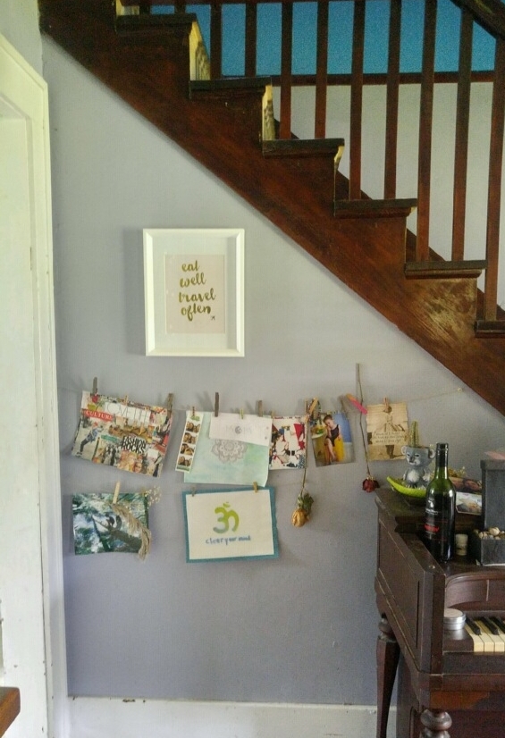 To the left of the piano, and right outside the kitchen entrance is a space for art and photos. The "Eat Well, Travel Often" print was a gift from her daughters for Mother's Day. This describes Brooke's goals very well. She has been a vegetarian most of her life and is committed to eating wholesome and ethically produced food. And, in the past few years, she has been enjoying some travel abroad....and enjoying some yummy food while there.