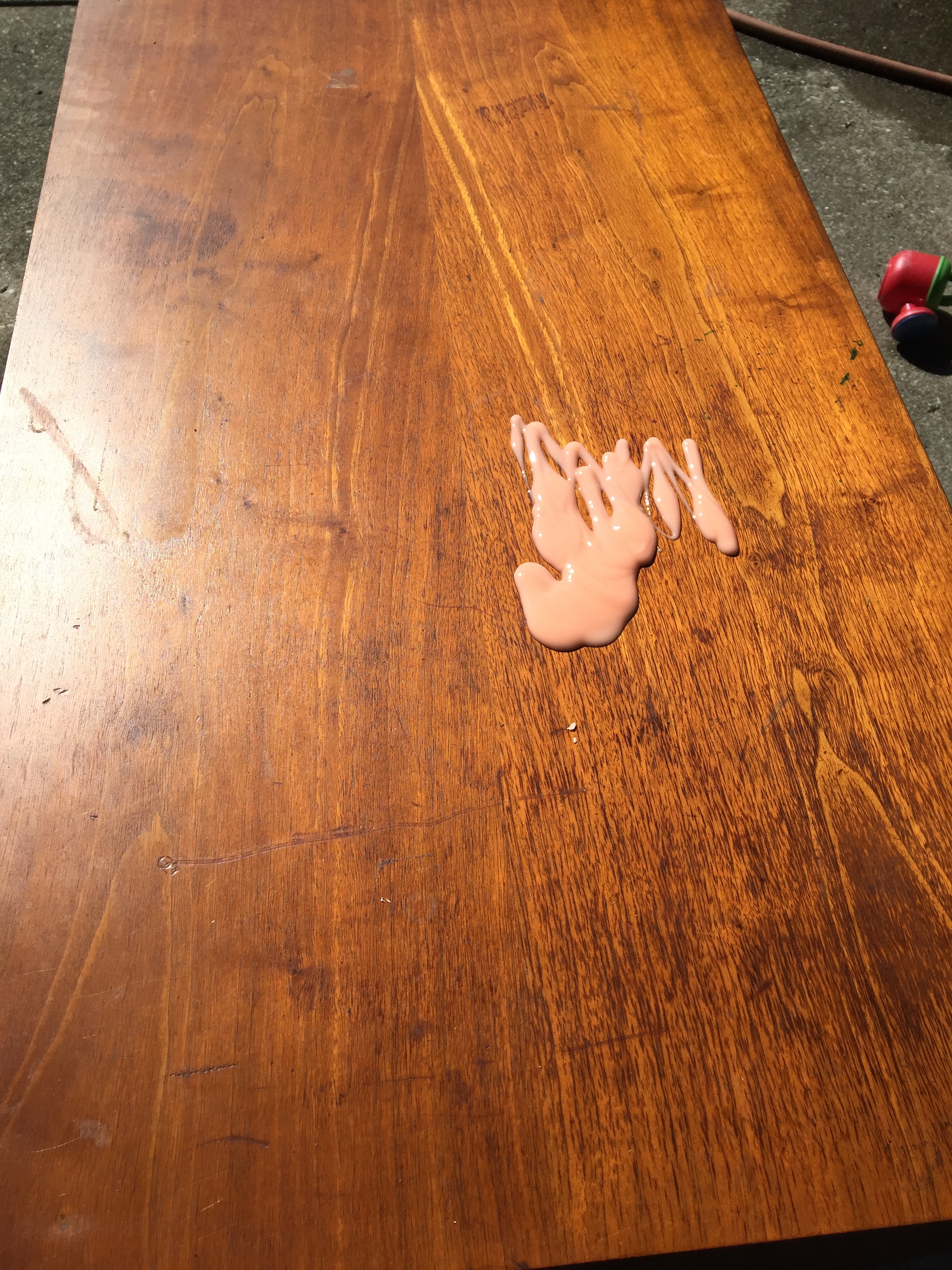 Here's where you would pour the stripper into a metal tray and then brush it on from there. Because I'm terrible at following directions, even my own, I just squirted it right on the surface and started spreading.