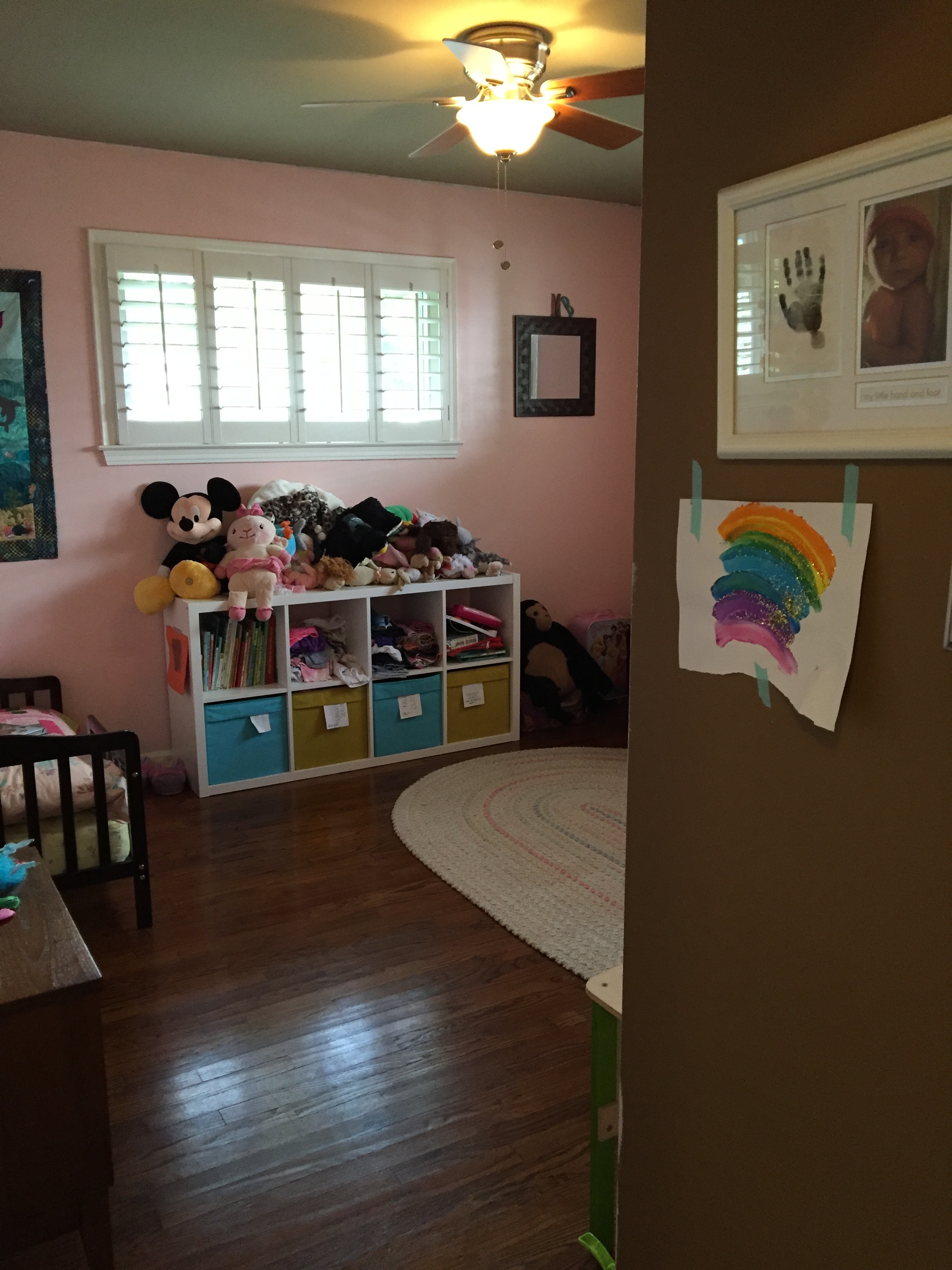 So, when you walk in, obviously everything is painted pink now. Almost everything. This little wall to the right when you walk in is the only part that is still the original chocolate color. That's because I'm still deciding what I want to do with it. It may be wallpapered or painted; still deciding.