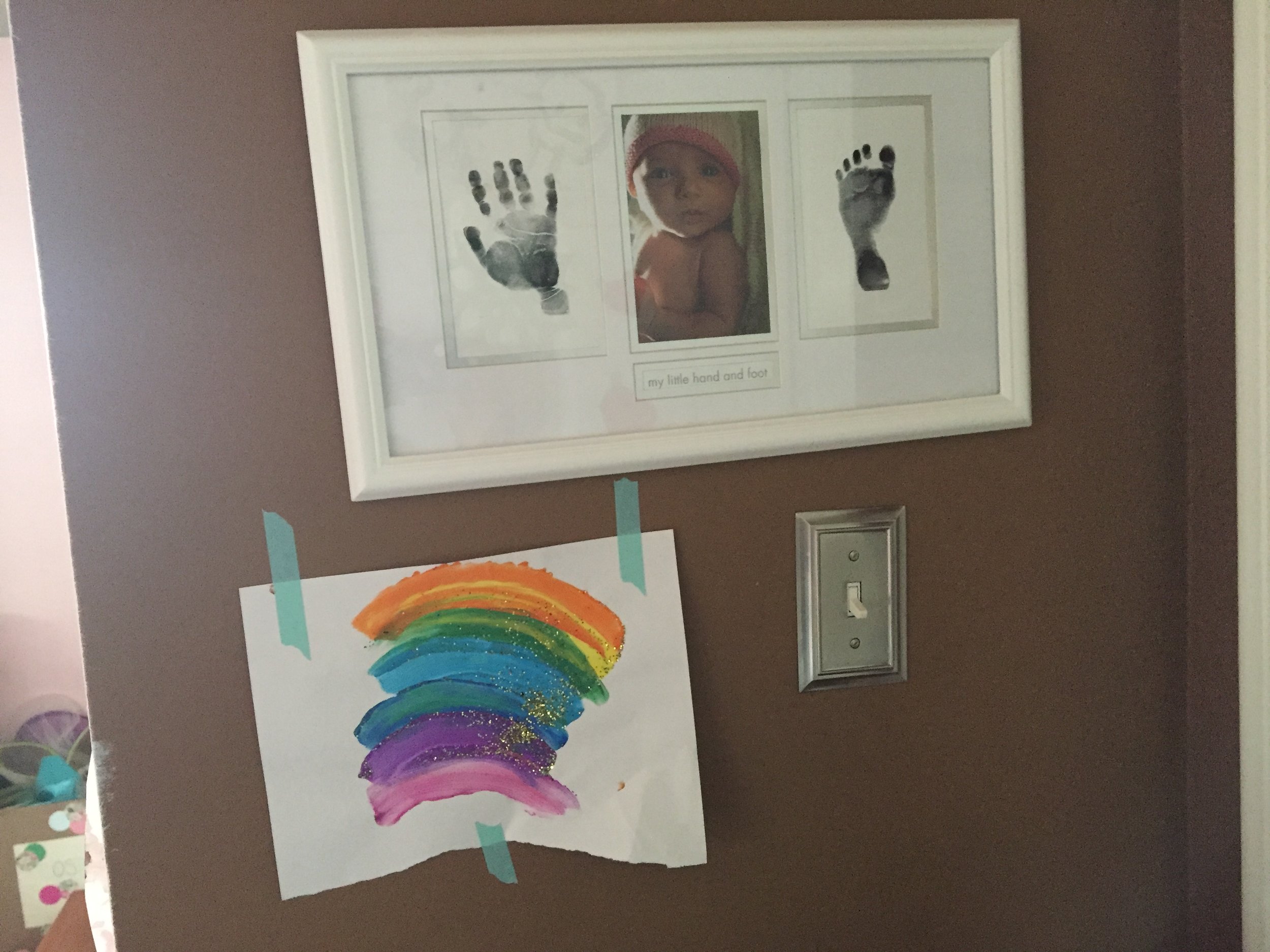 Meena's baby pic and hand/footprint. Frame gifted from my sister-in-law. Art by Meena.