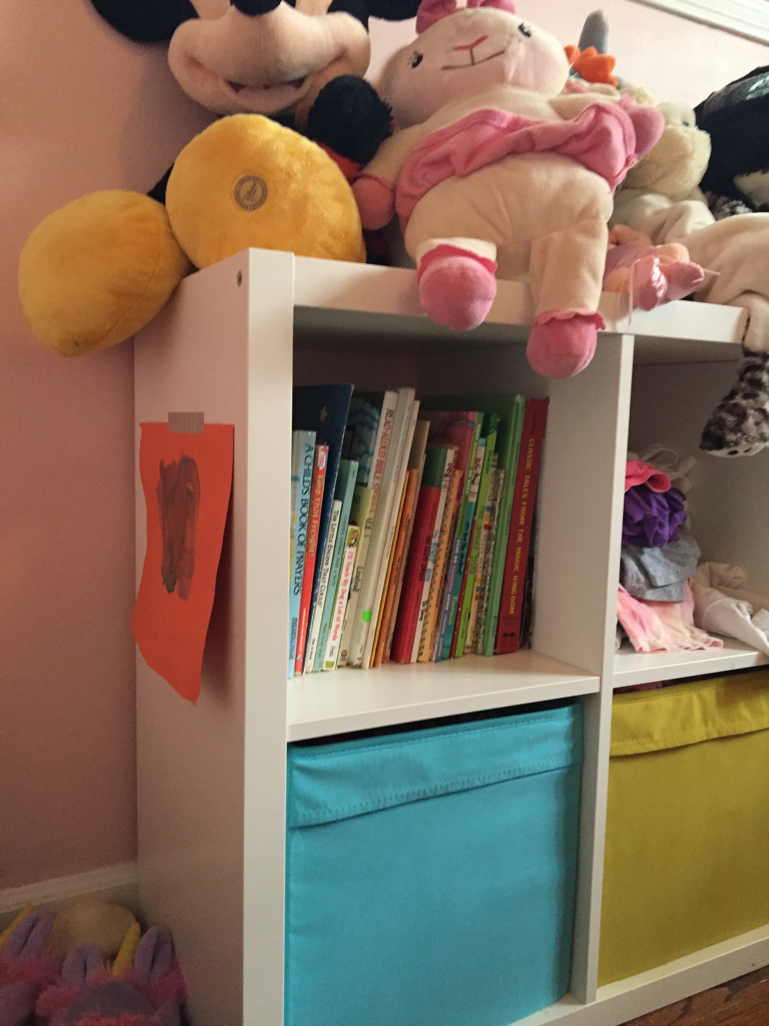To the right of the bed is the cubby shelf that houses clothes, books, and toys. And another place to stick up some art. Cubby Shelf: IKEA; this is literally the ONLY thing in the room that was bought "new".