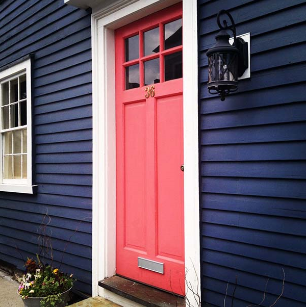 Image Credit: AspireMetro.com I. LOVE. EVERYTHING. ABOUT. THIS. A coral pink door popping against navy siding? Yes, yes, and forever, YES. I'm pretty sure there should be a law that says if you have navy siding (lucky!), you HAVE to paint your door this color.