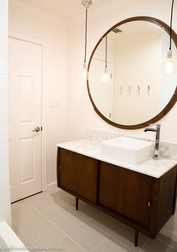 Pinterest Nice! Looks like they turned a credenza into a vanity too. And their sink is off-center like ours. 