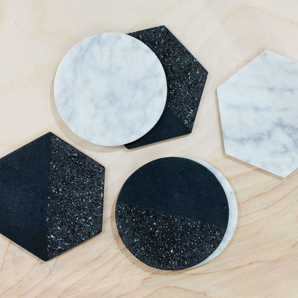 La Piedra Coasters - $55 - Set of 6 (THIS IS A GREAT DEAL) - these are hand-carved in black volcanic rock and white marble stone, with cork bottoms to protect your tables - Takes several days to complete.