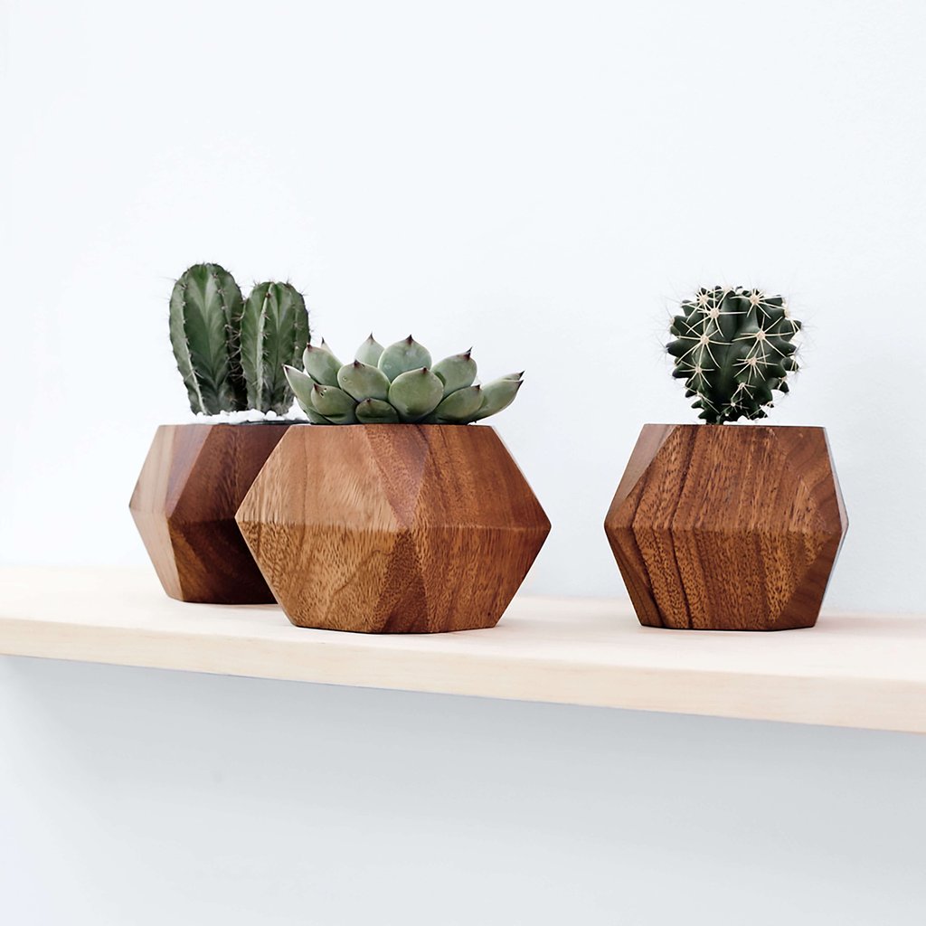 Adia Planter - $65 for a single one, $185 for a set of 3 - handcarved from Mugavu wood - and new trees are replanted by the coop makers to replace the trees used.