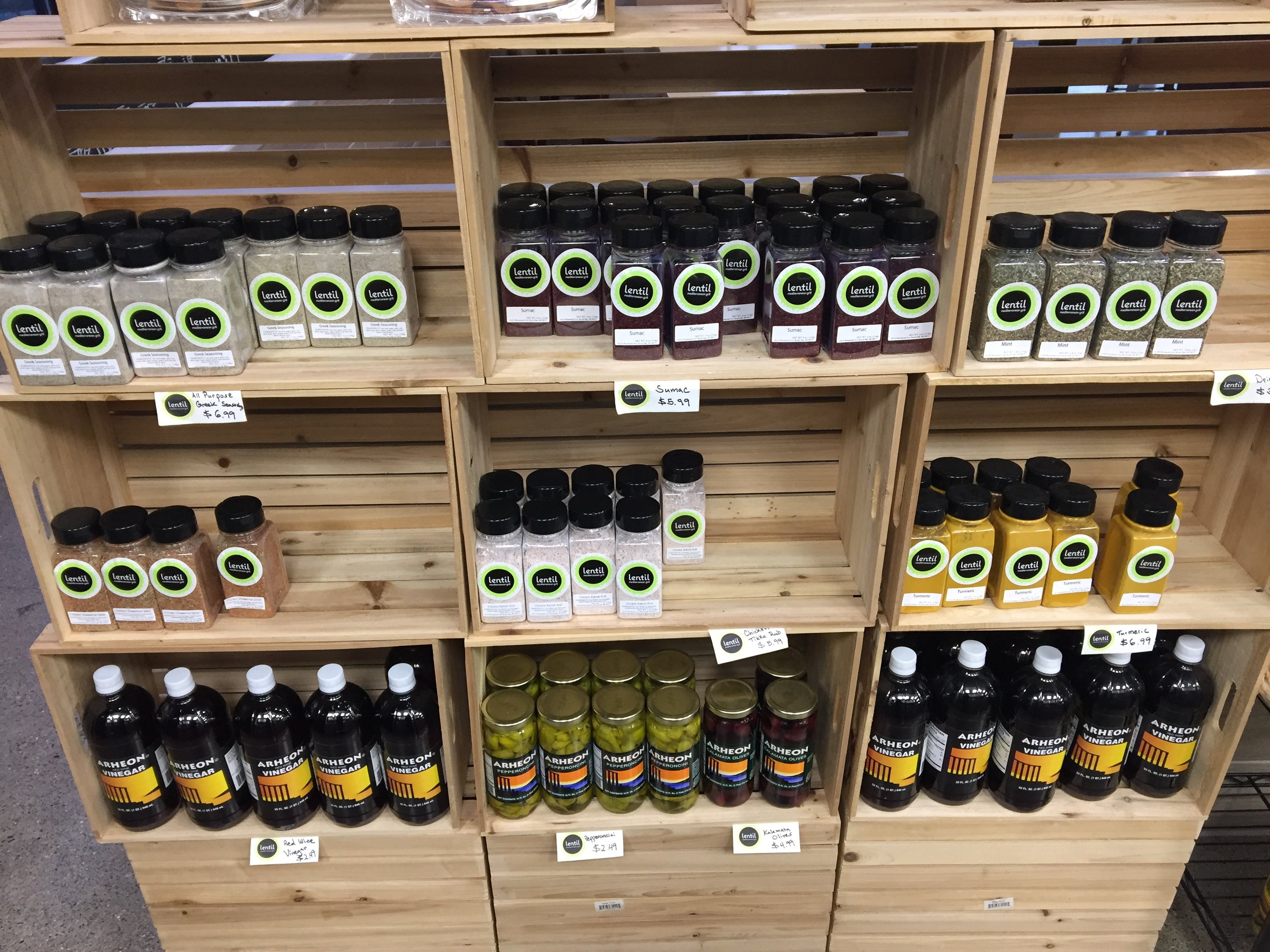 The wall of spices, dressing, flavorings that they sell.