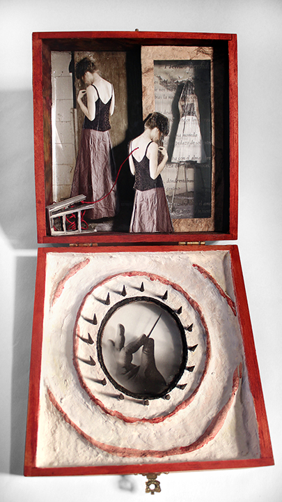 The inside is sculpted with paper maché. The figure on the ladder is seen through a Pablo Neruda poem.