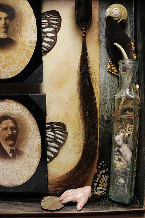 Detail of the inside. There is a tiny porcelain figure inside the bottle, it came from a dig outside a doll factory in German. 