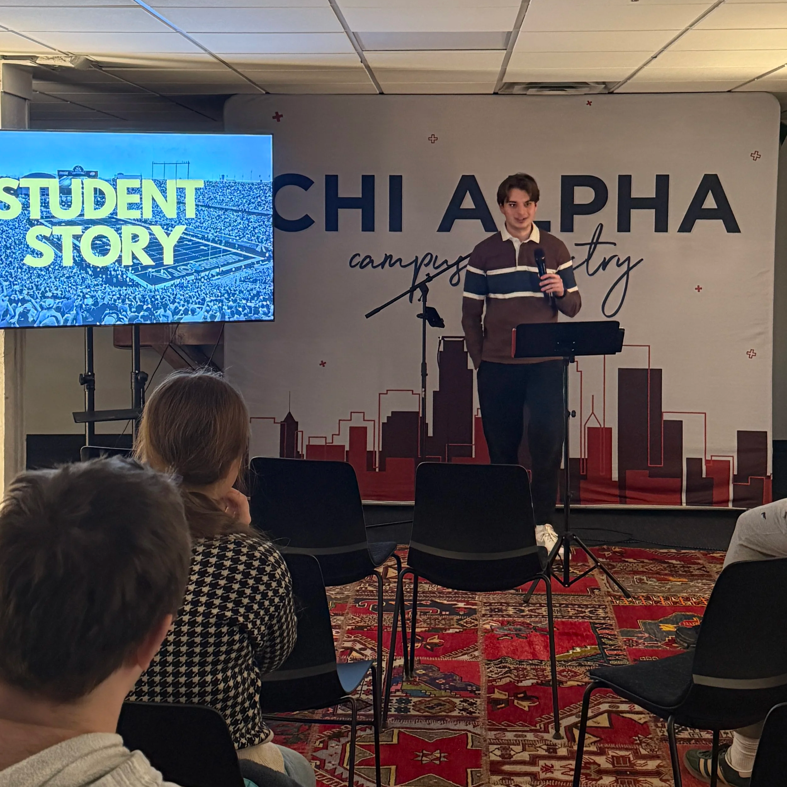 Student speaks to the large group.