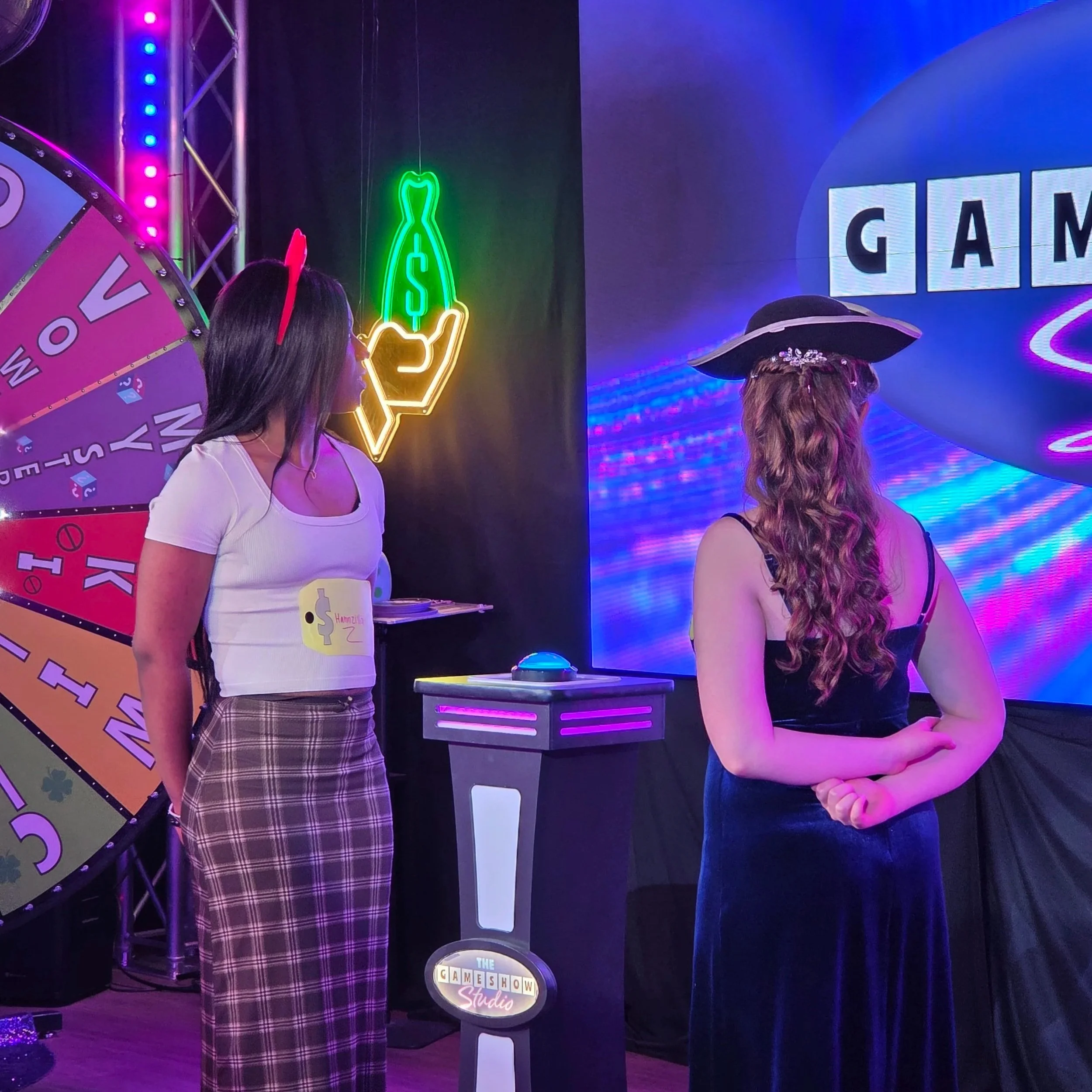 Two students at a game show.