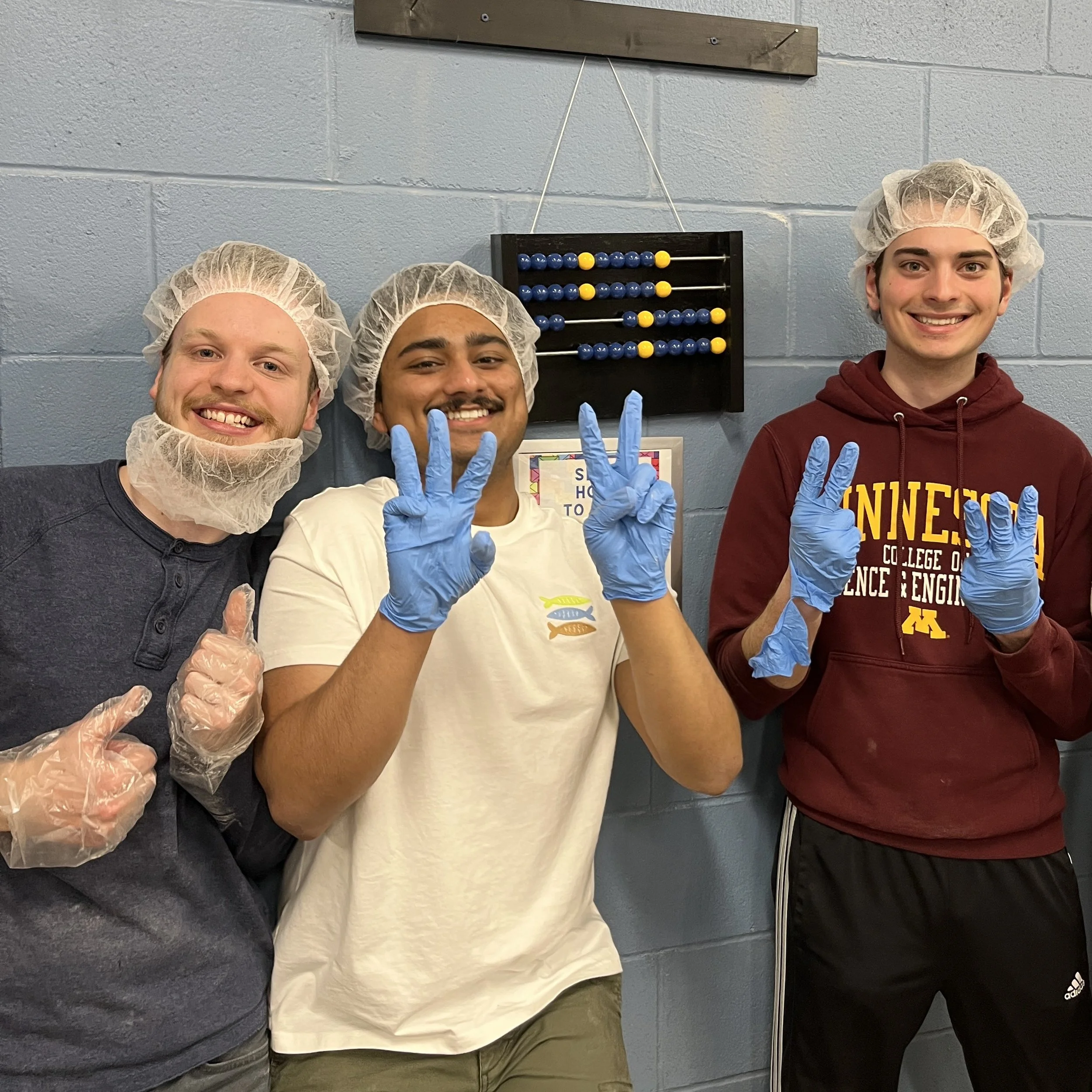 Group of students in hairnets volunteering