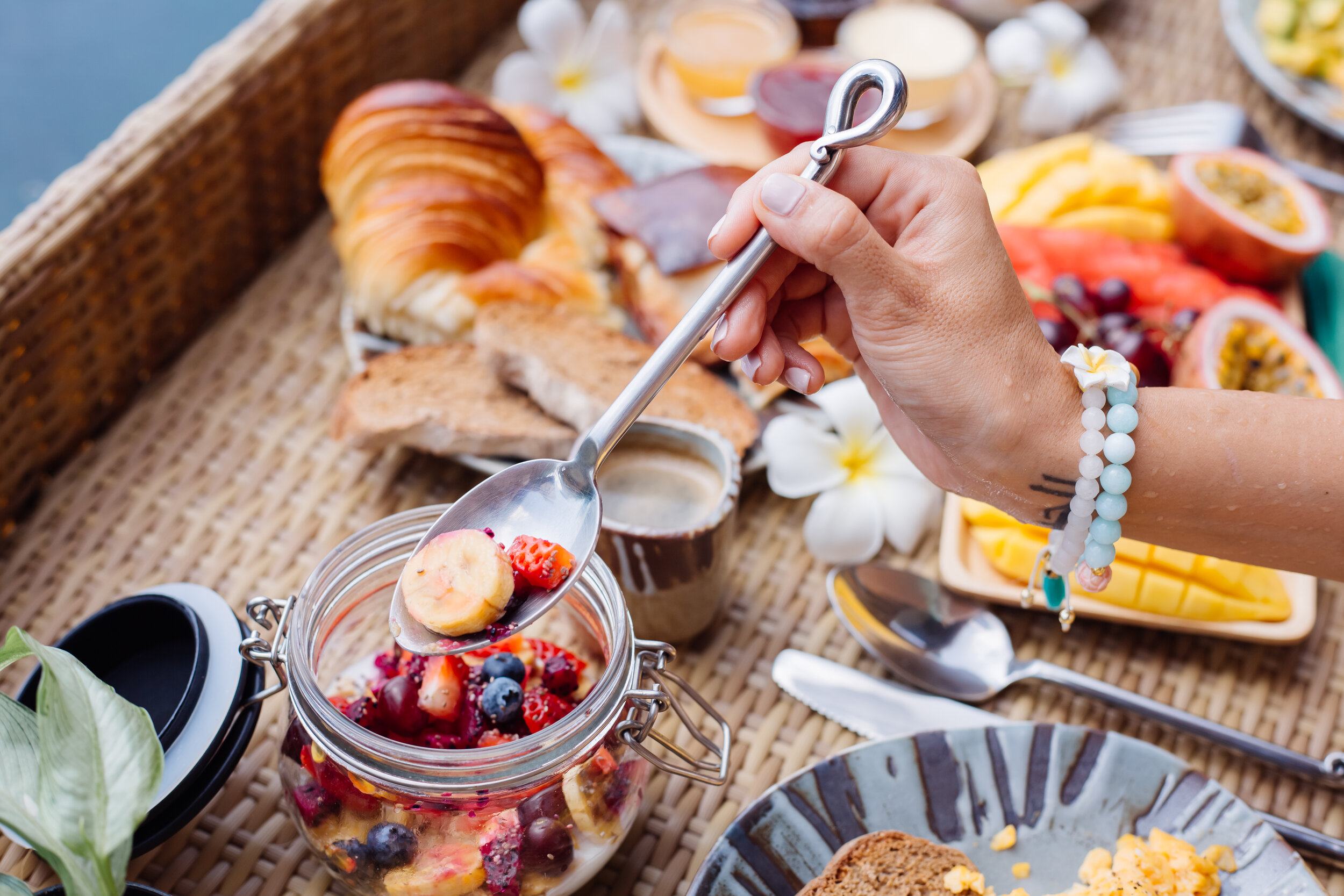 woman-having-tropical-healthy-breakfast-villa-floating-table.jpg