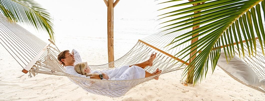 cayman-brac-couple-in-beach-hammock-1060x403-min.jpg.jpeg