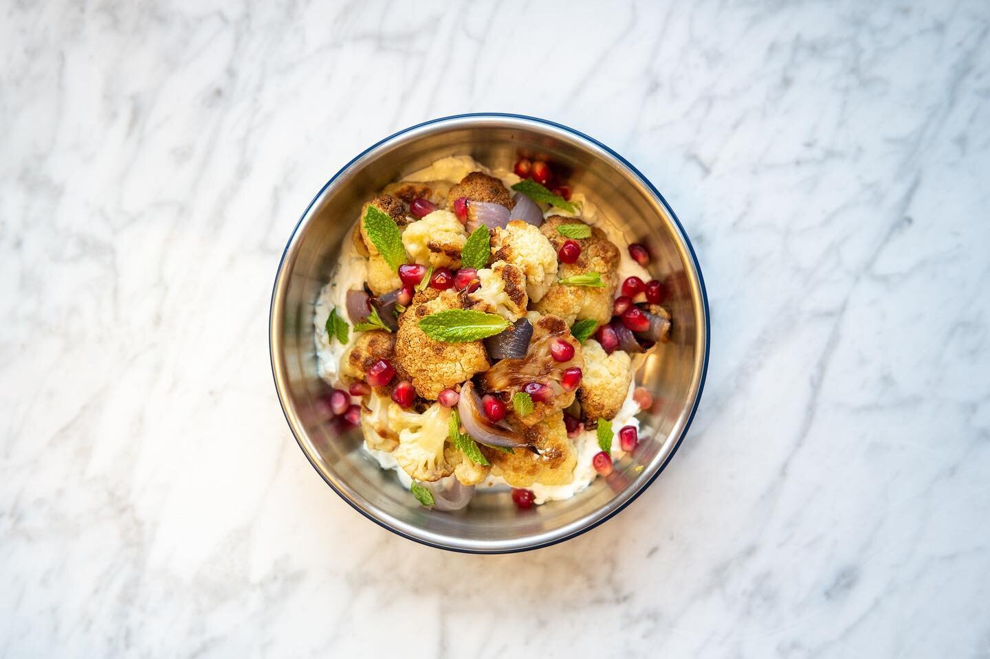 Leftovers &mdash;&gt; lunch time salad. I roasted a tray of cauliflower and red onions the other night for dinner and reimagined the leftovers into a hearty salad for lunch today. I tossed the cauliflower and onions w some mint and pomegranate on top