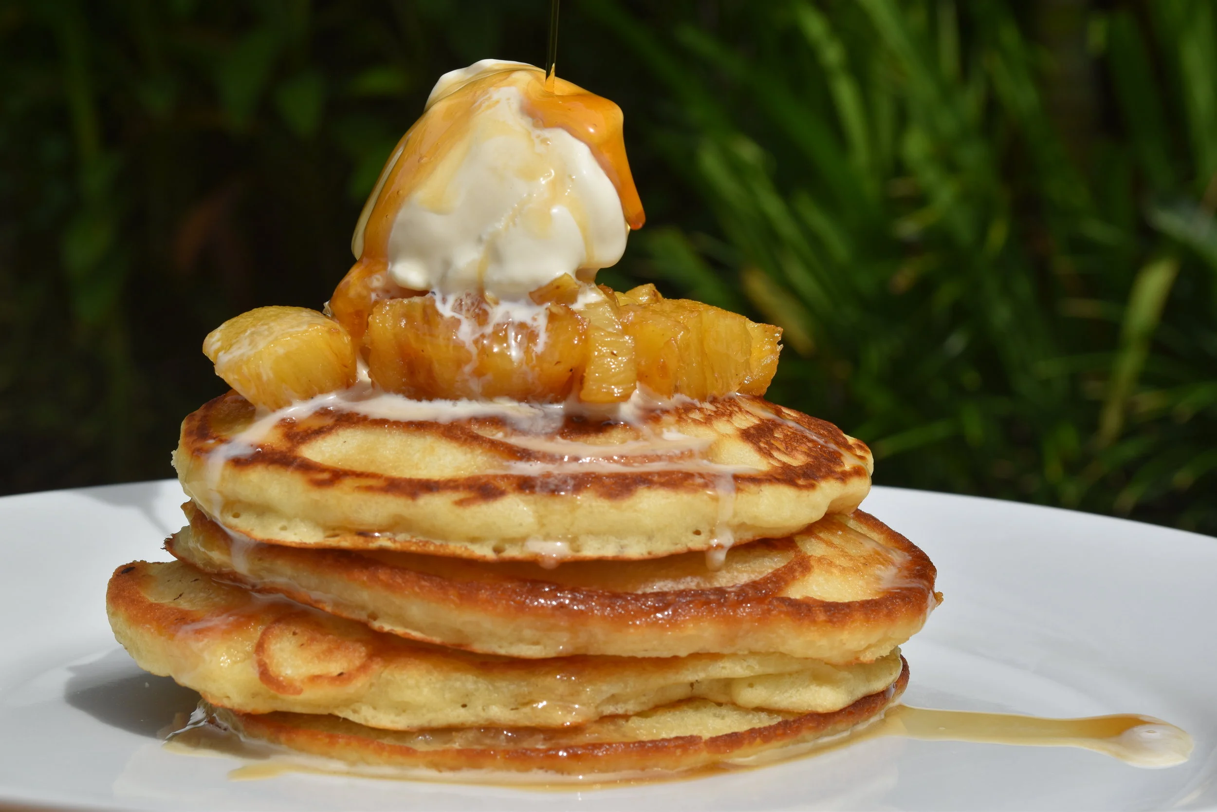 Coconut pancakes with caramelized pineapple and vanilla bean ice cream.