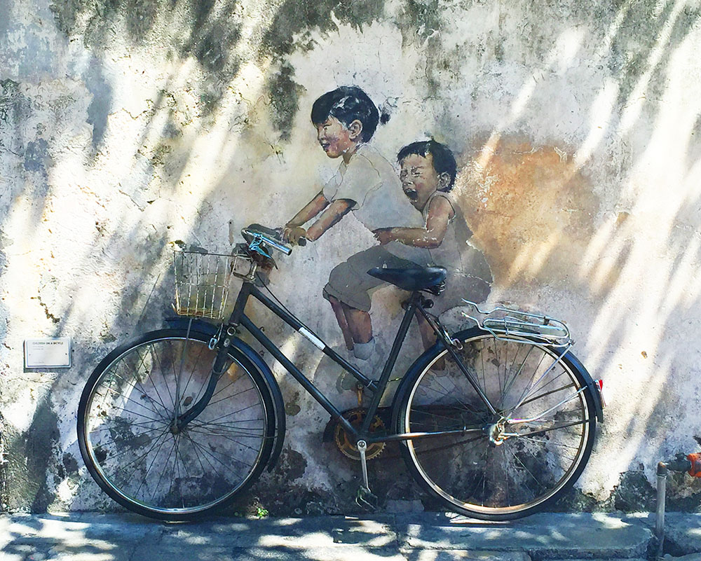 How stunning is this? If you look closely you'll see that the bike is actually real. It's been fastened to the wall over the painting!