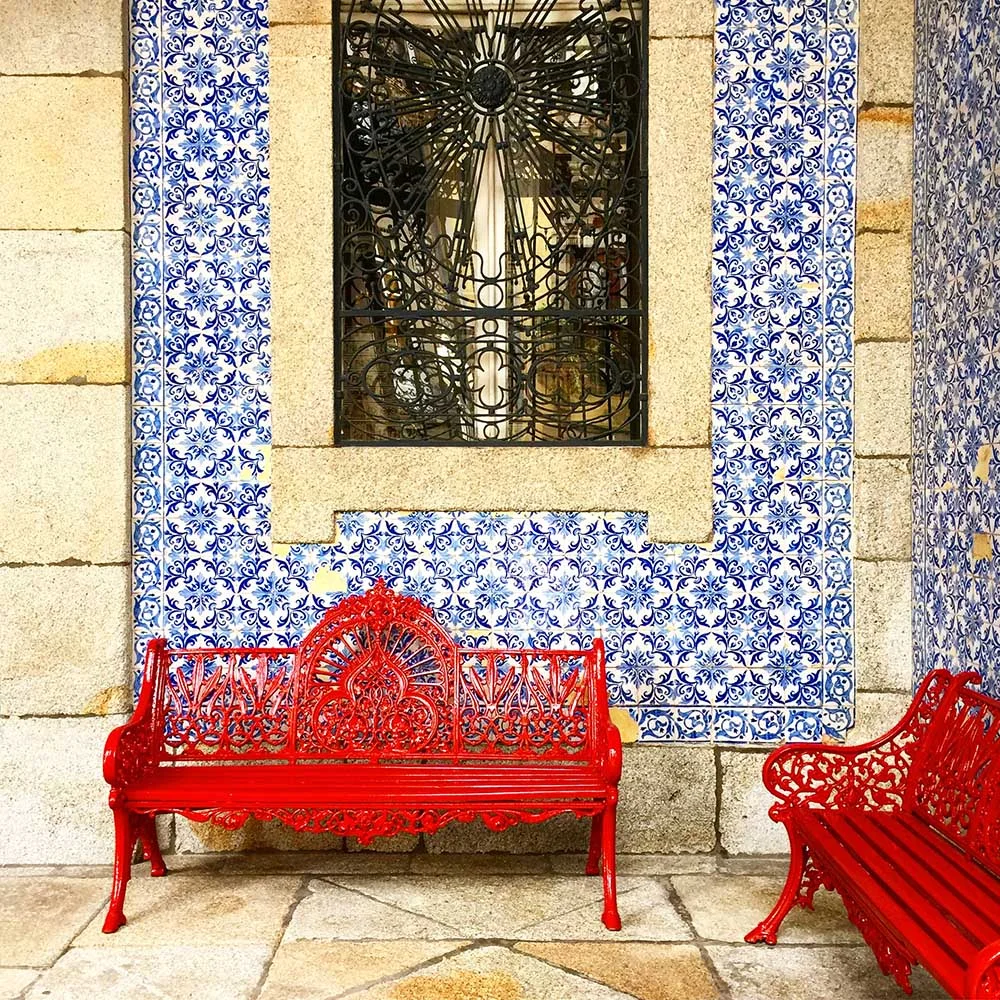Brightly colored, patterned ceramic tiles, known as “azulejos”, cover the outside of buildings all over Portugal.