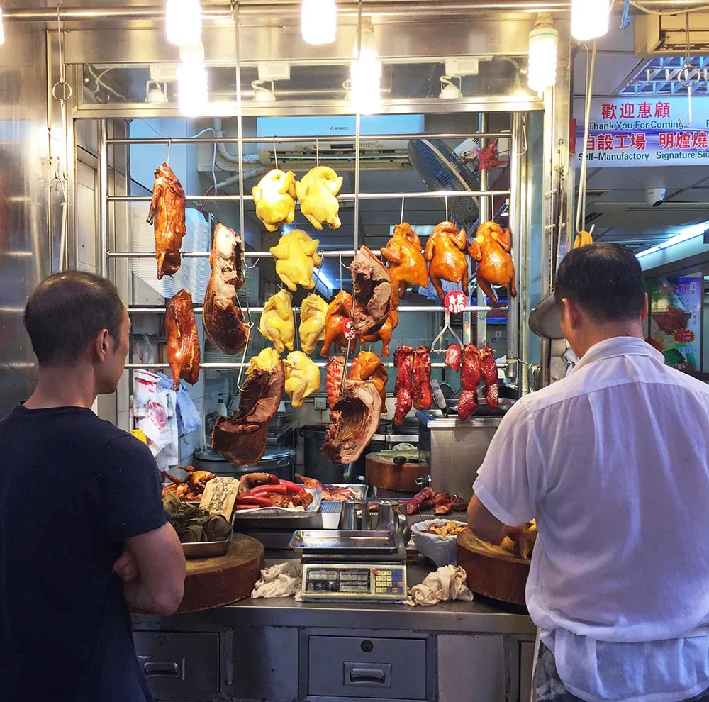 Various fowl for sale in a street market. 
