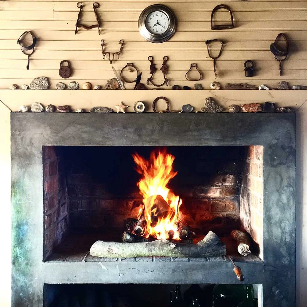 The roaring fire at Chez Silvia, and a wonderful collection of found objects on the mantel. 