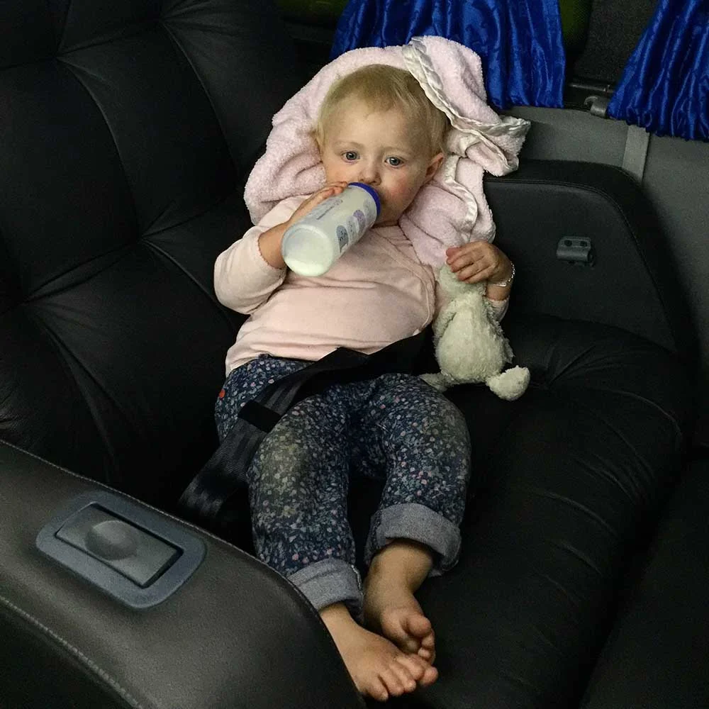 Rosie settling in for our overnight bus ride, over the Andes mountains, from Mendoza, Argentina to Santiago, Chile. Planes, trains, boats, buses... nothing seems to faze her! 