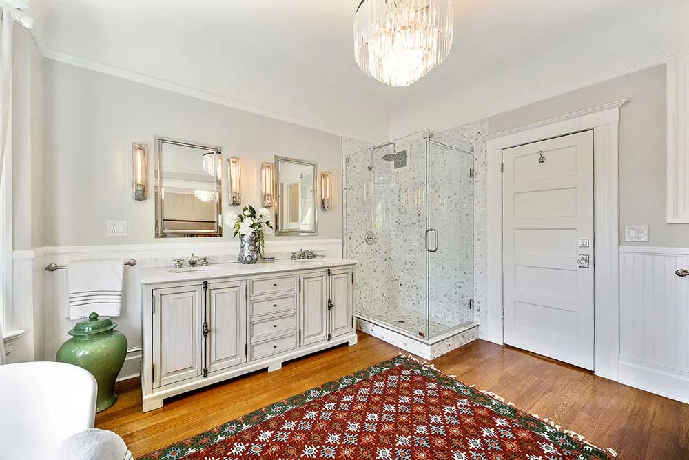 I wanted to make sure we had plenty of storage (this would become a theme throughout the whole apartment) and so the two mirrors are actually recessed medicine cabinets with substantial depth - also in polished nickel. The rug in this room is one that we found on our travels in India.