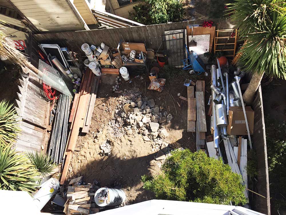 This is the view from our bedroom windows, down to our future yard. There was no access to this outdoor space through our apartment, so we needed to fix that. 