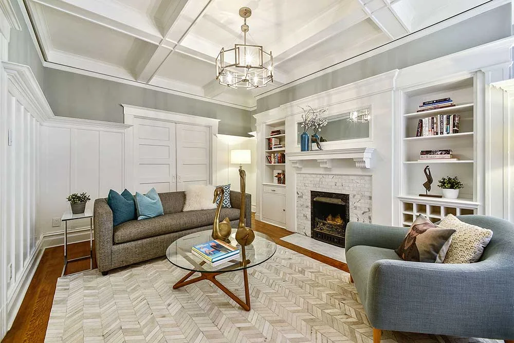 We restored the original Victorian fireplace, and tiled it with the same marble we used in our master bathroom. 