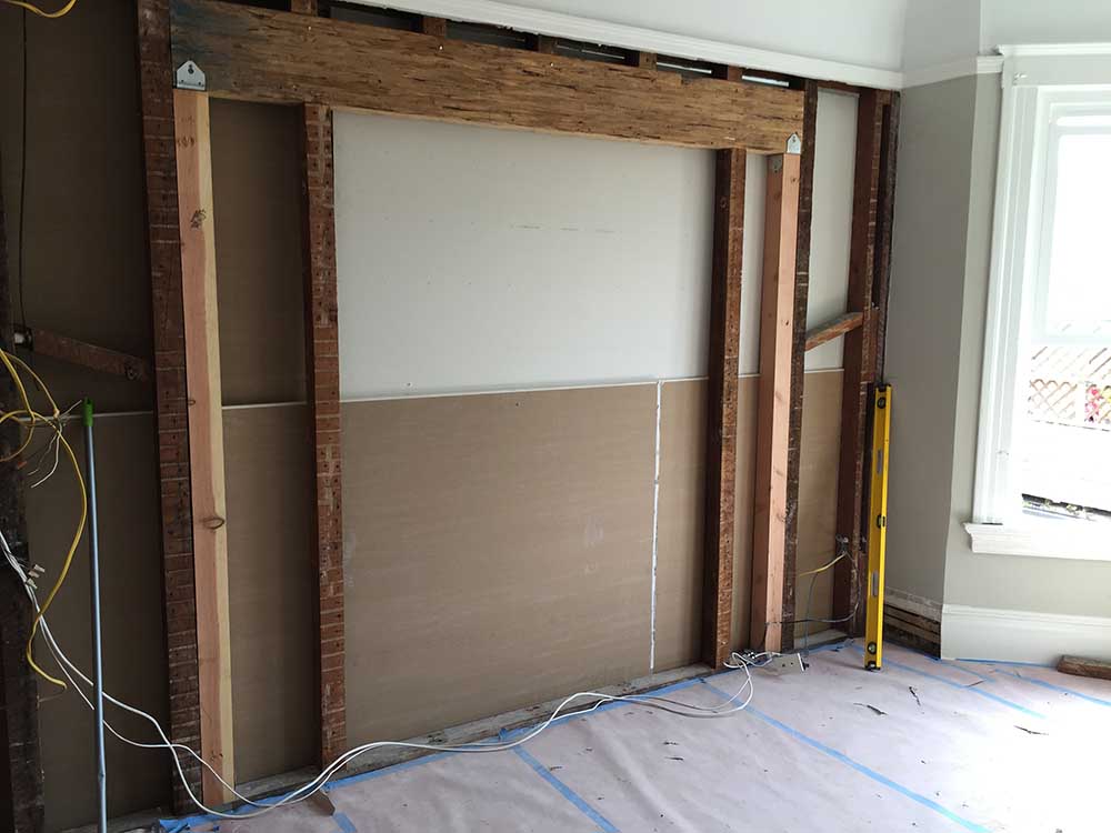 We needed to break through a wall to make space for the French doors that would open between the master bedroom and bathroom, and this is the structural preparation for that opening. 