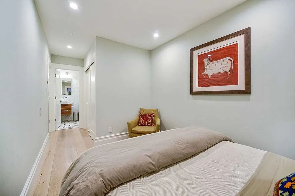 This bedroom isn't huge, but we managed to find the space for built-in storage and an ensuite bathroom. 