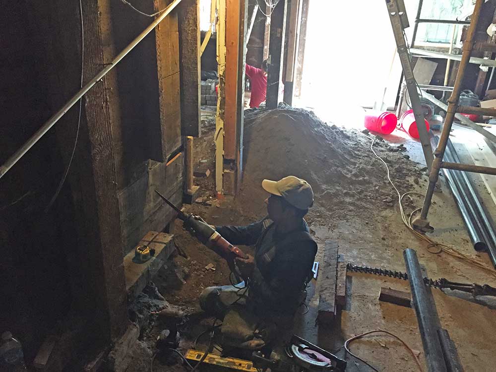 Breaking through walls to combine rooms. 