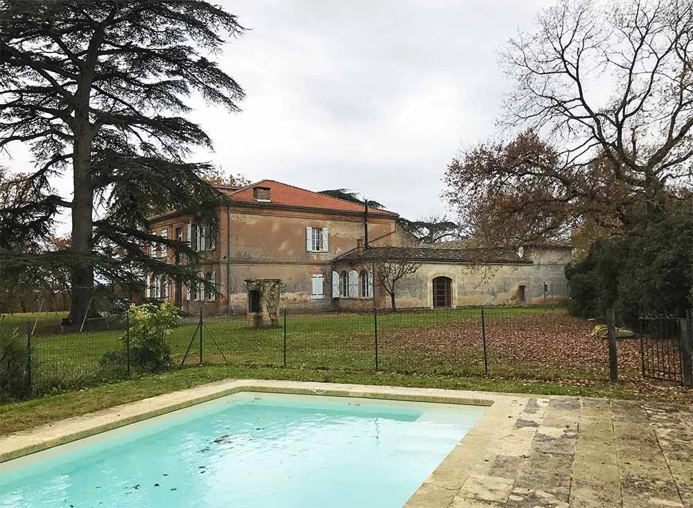 A view of the house from the pool. You can see the original water well in this shot too. 