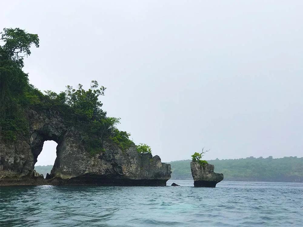 This craggy island sits in Crystal Bay. 