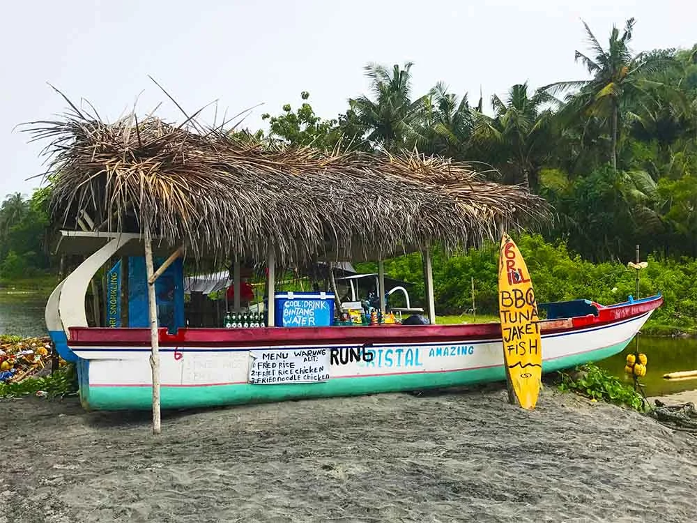 This fishing boat has been turned into a BBQ shack on Crystal Bay. 