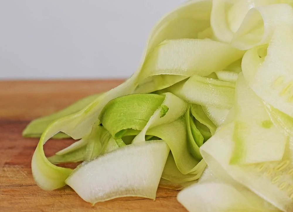 Zucchini noodles 'zoodles' made with a vegetable peeler.