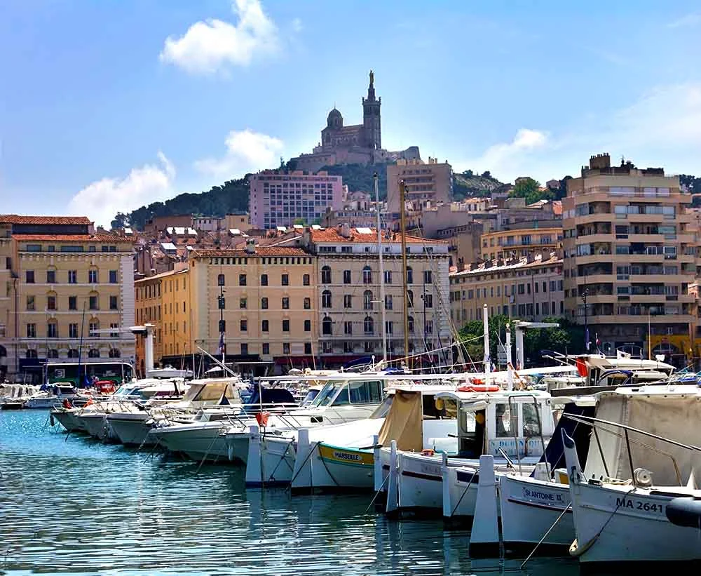 A view of Basilique Notre-Dame-de-la-Garde from the port in Marseille. 