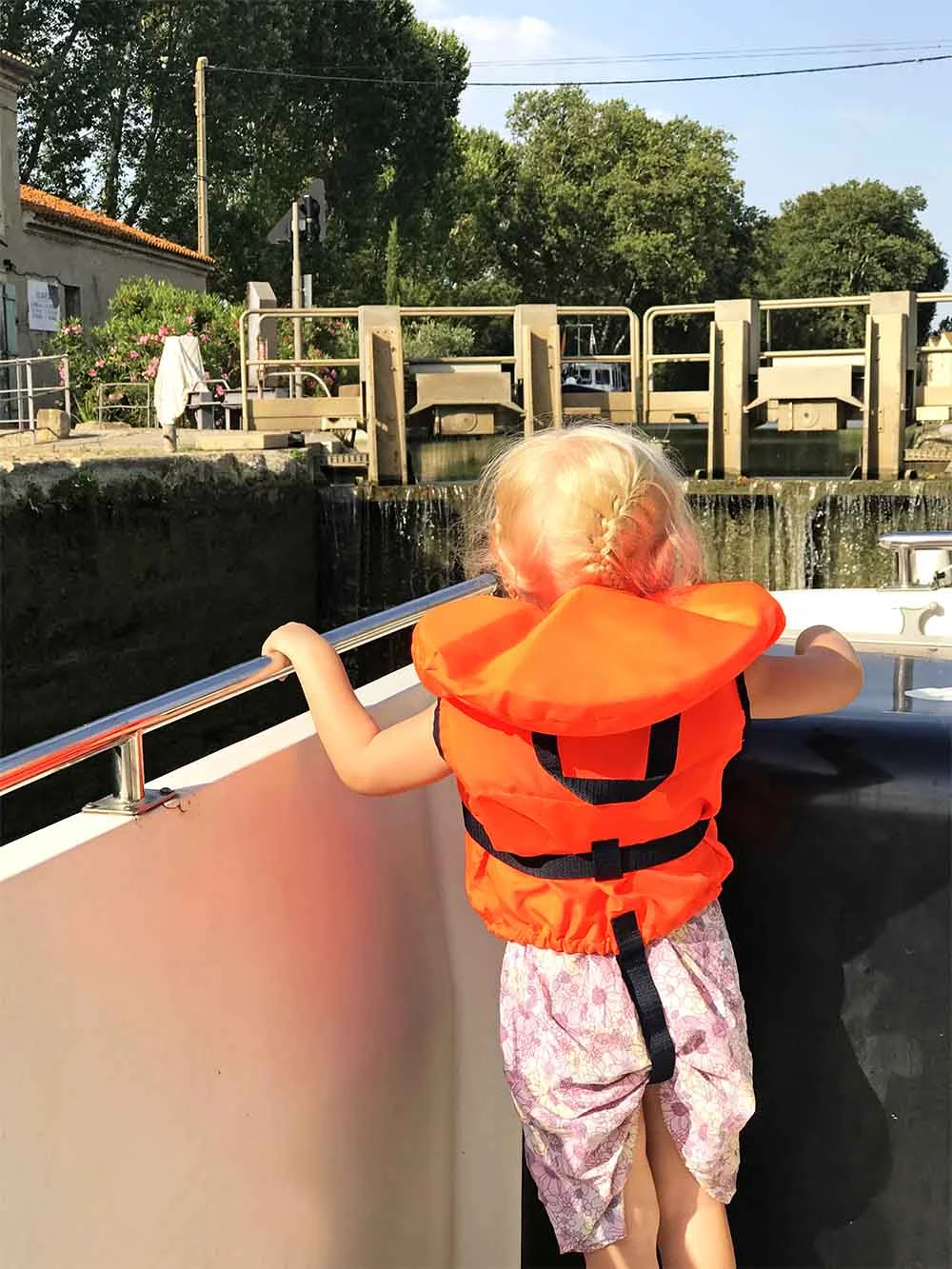 Approaching a lock from below. You can see the water filling the lock to lift our boat to the correct water level. 
