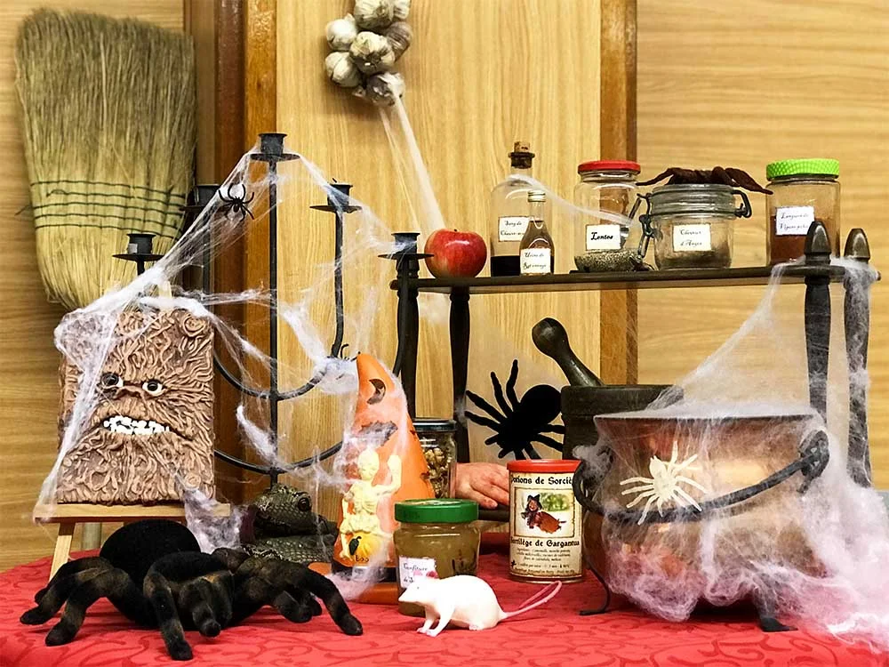 I love this Halloween display, with the hanging garlic and all the potions and magical herbs. It was created by a Mum, for a free Halloween event that we attended in a nearby village.