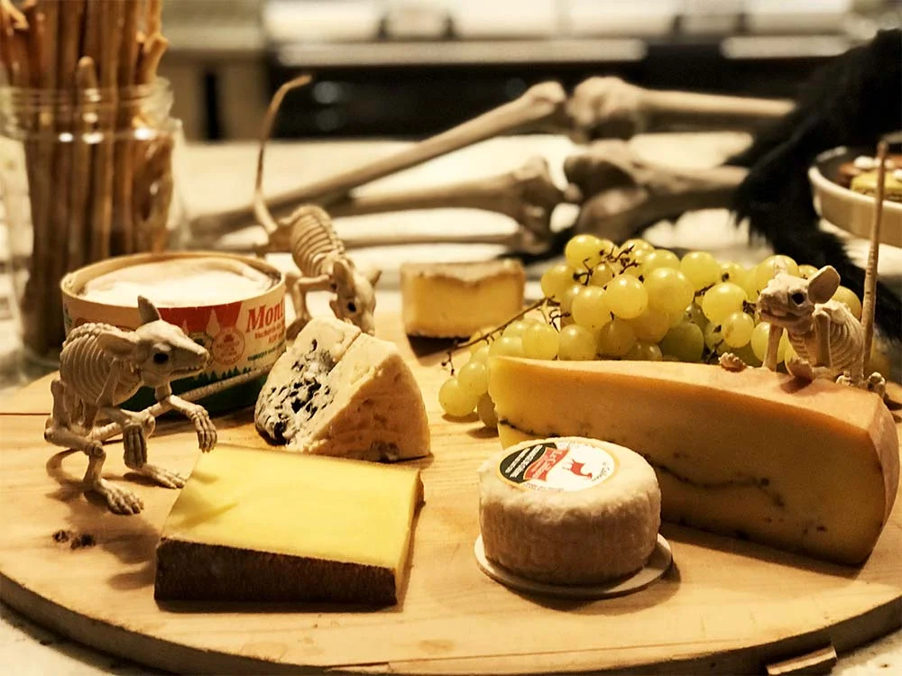 Some beautiful French cheeses, infested with skeleton rats.