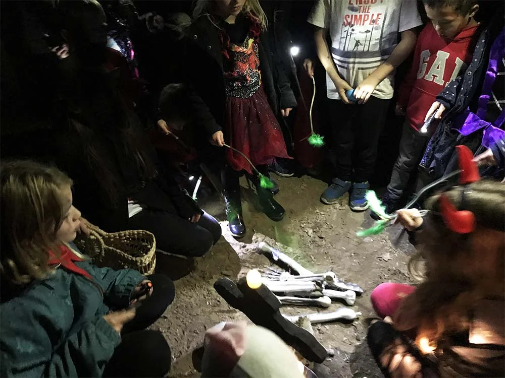 Together the kids returned the missing bones to the grave, and recited a spell. I love how they’re all holding their wands over the bones!