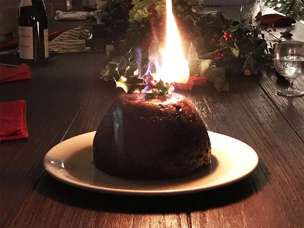 The Christmas pudding, set alight.