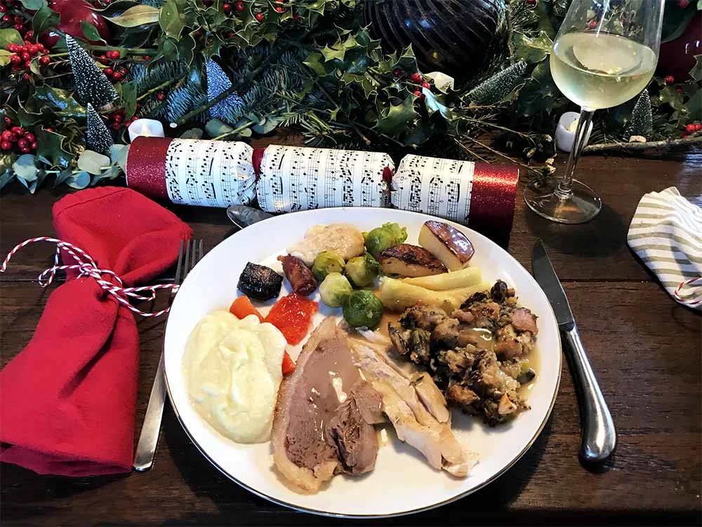 Clockwise from the top; we feasted on Brussels sprouts, goose fat roast potatoes, parsnips, bread stuffing made with prunes and our own foraged hazelnuts , turkey, goose, celeriac puree, roasted carrots, red pepper jelly, pigs in blankets (bacon wrapped sausage), devils on horseback (bacon wrapped prunes), and bread sauce.