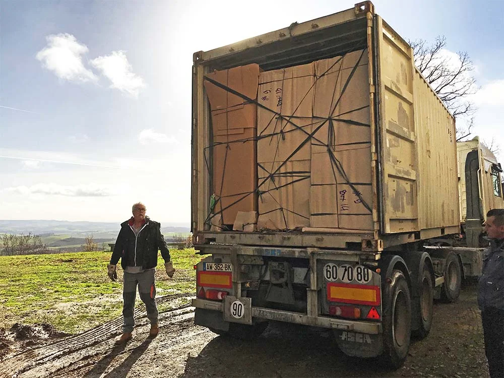 Inside our shipping container! How relieved does the lorry driver look?