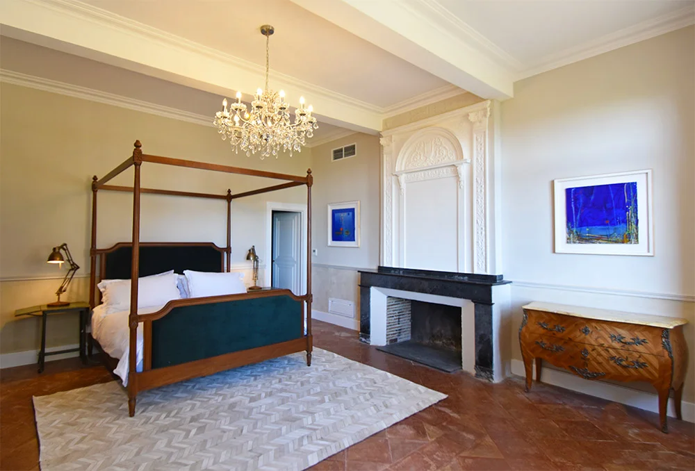 This mahogany four poster bed with dark green velvet headboard and baseboard was one of the pieces made for us in Bali.